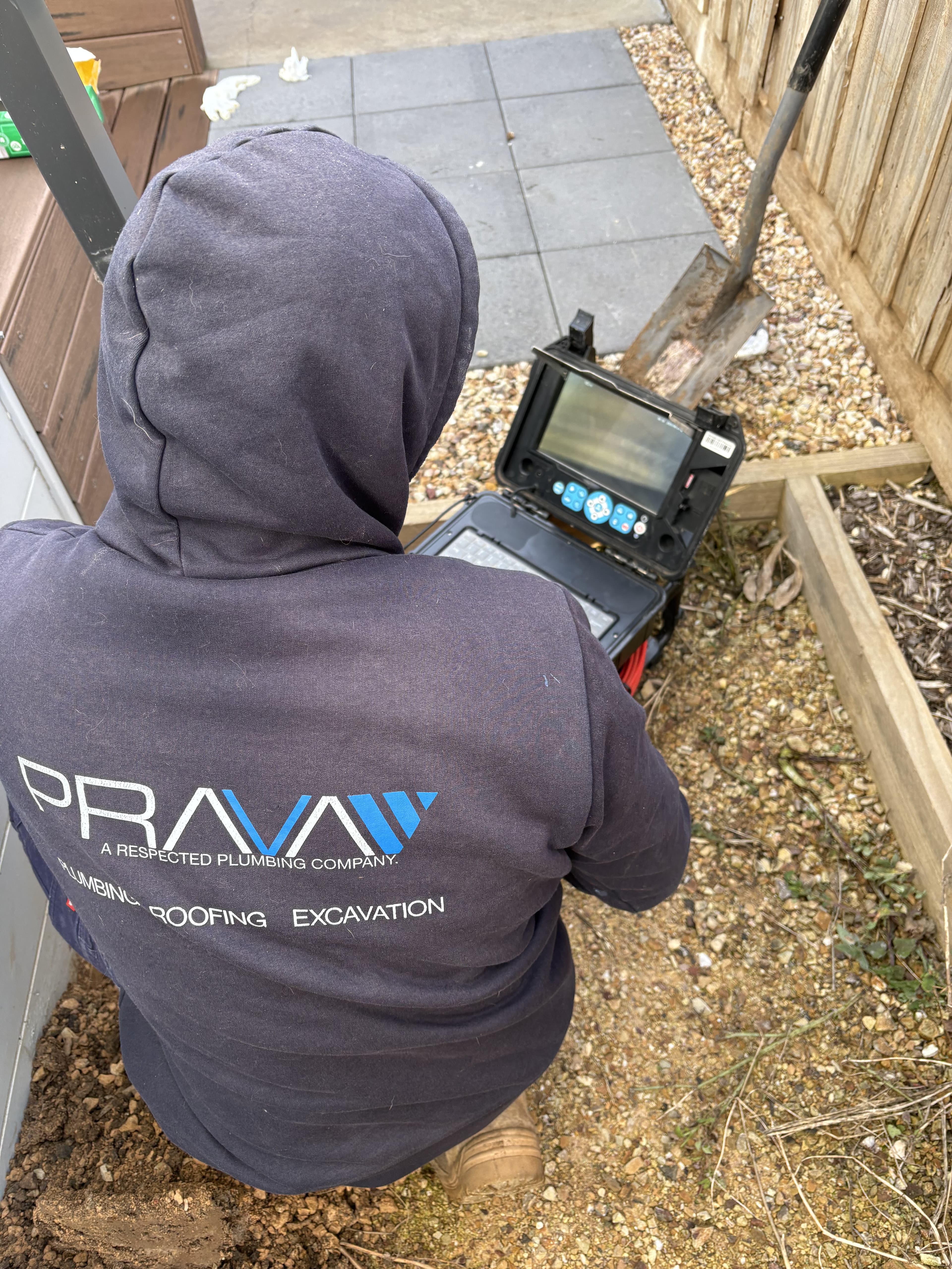 Prava technician reviewing footage from a CCTV drain inspection