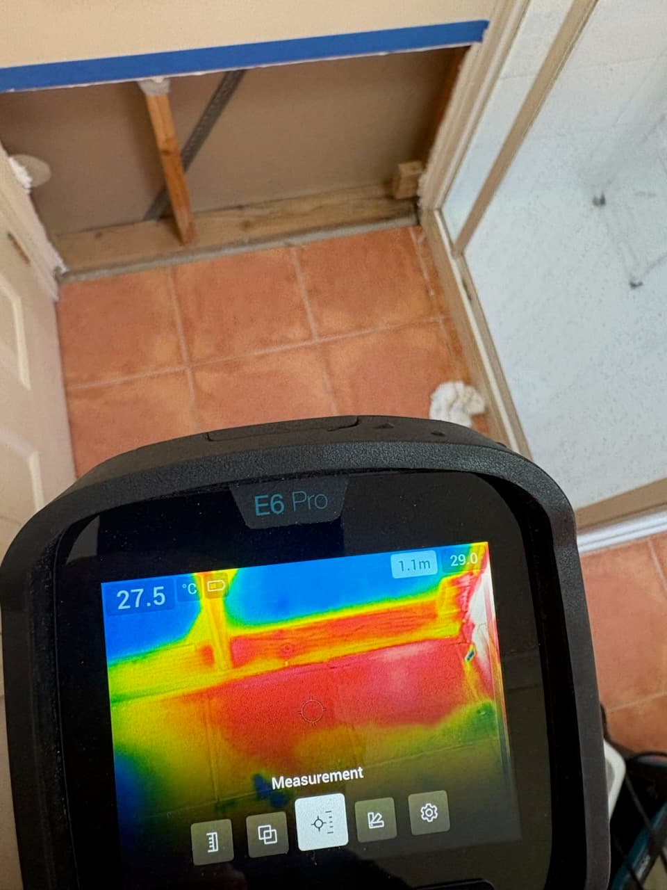 Thermal imaging camera heatmap at a doorway threshold